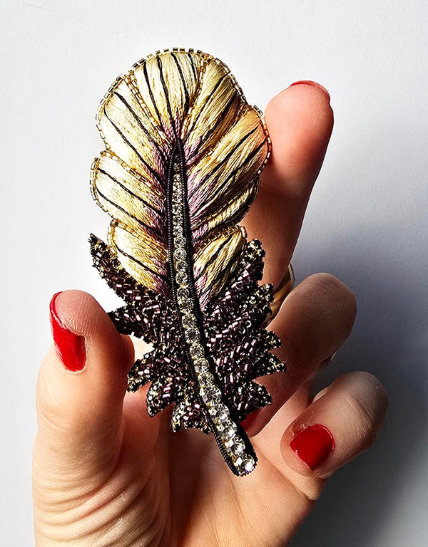 Gold-colored feather brooch- Pre-orders available mid-June