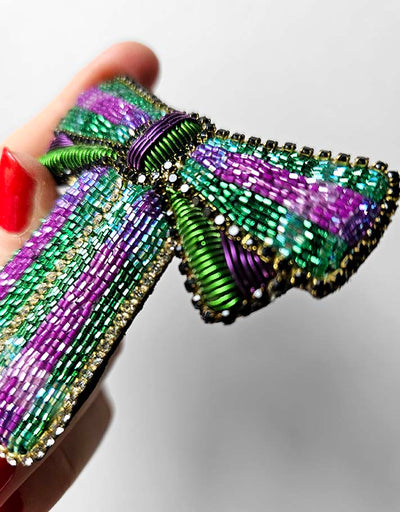 "A pretty green & purple bow " brooch
