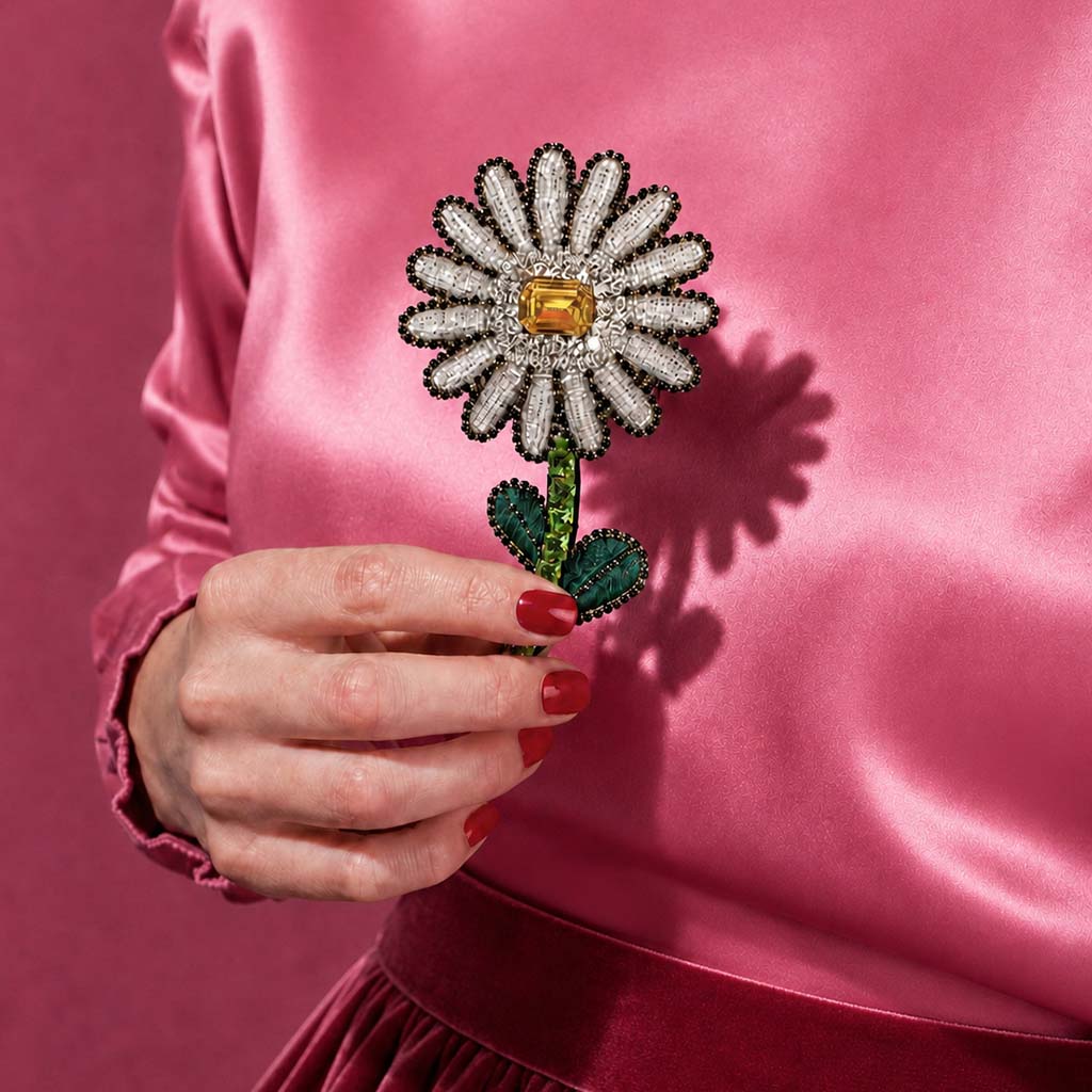 Model wearing several Céleste Mogador flower brooches