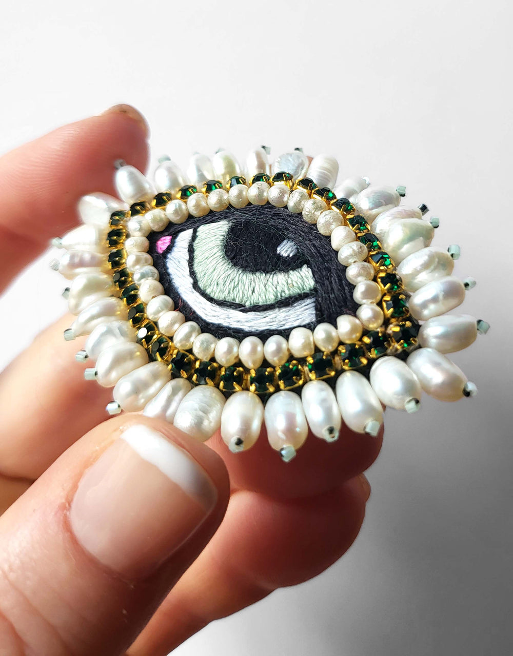 WHITE BAROQUE EYE BROOCH