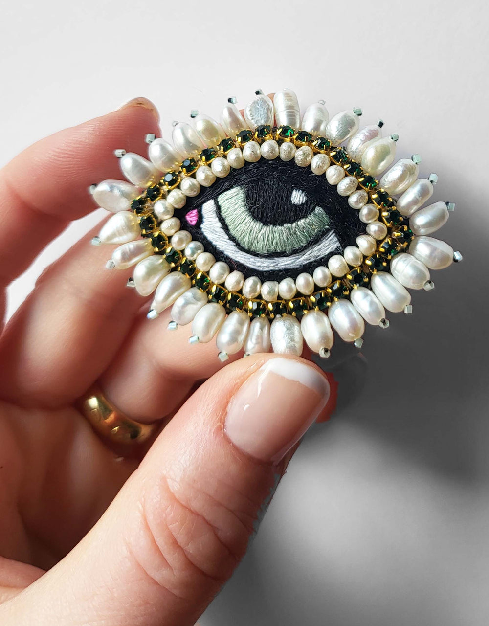 WHITE BAROQUE EYE BROOCH